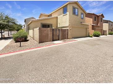 Two-story home with attached garage and desert landscaping at 4760 W Carson Rd, Laveen, AZ 85339