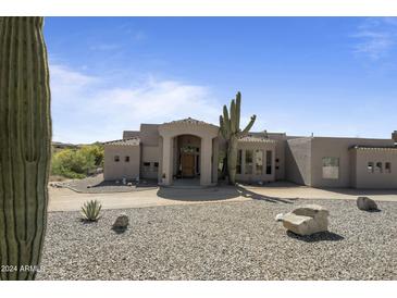 Spacious home with desert landscaping and large windows at 35108 N 139Th Way, Scottsdale, AZ 85262