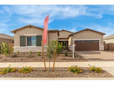 Front view of two-story home with landscaping at 23964 N 171St Ln, Surprise, AZ 85387