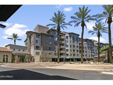 Exterior view of The Landmark building with palm trees at 15802 N 71St St # 307, Scottsdale, AZ 85254