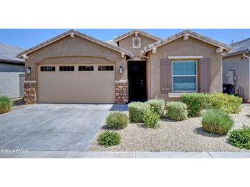 One-story house with a two-car garage and landscaped front yard at 9624 E Thunderbolt Ave, Mesa, AZ 85212