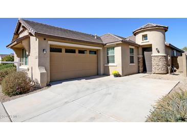 House exterior view, featuring a two-car garage and stone accents at 2834 E Fraktur Rd, Phoenix, AZ 85040