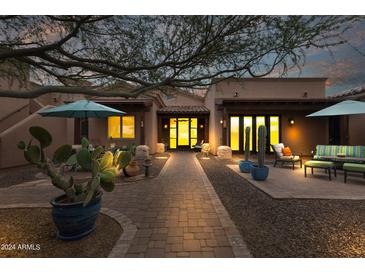 Relaxing courtyard with seating area and desert landscaping at 7016 E Grand View Ln, Apache Junction, AZ 85119