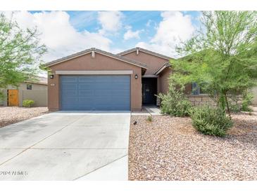 Modern house exterior with gray garage door at 4455 W Suncup Dr, San Tan Valley, AZ 85144