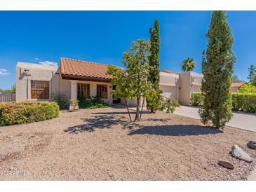 Spanish style home with a tile roof and nicely landscaped yard at 14602 N Olympic Way, Fountain Hills, AZ 85268