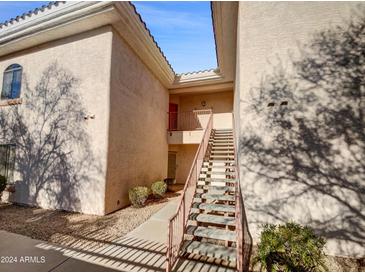 Exterior view of a building showing stairs leading to an entrance at 10030 W Indian School Rd # 257, Phoenix, AZ 85037