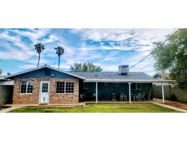 Spacious backyard with covered patio and lawn at 1360 W 15Th St, Tempe, AZ 85281