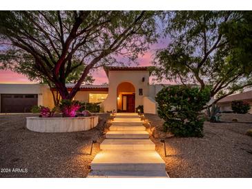 Stunning home exterior with beautifully landscaped entryway at 9020 N 33Rd Way, Phoenix, AZ 85028