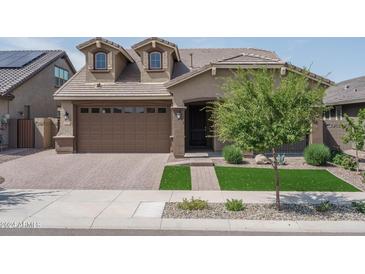 Beautiful two-story home with landscaped yard at 16062 W Alameda Rd, Surprise, AZ 85387