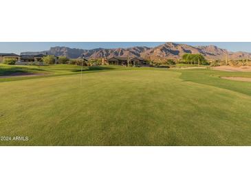Golf course view with mountain backdrop at 9633 E Quarter Circle Loop, Gold Canyon, AZ 85118