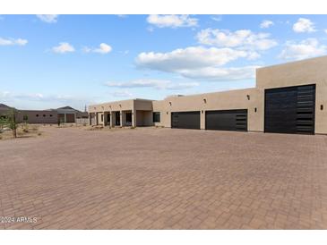 Luxury home boasting a large driveway and three-car garage at 39220 N 30Th Dr, Phoenix, AZ 85086