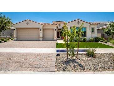 Beautiful two-car garage home with landscaped yard at 9649 E Solina Ave, Mesa, AZ 85212