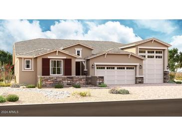 Two-story home with a three-car garage and stone accents at 19691 E Estrella Rd, Queen Creek, AZ 85142