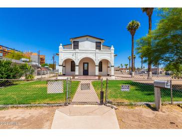 Charming two-story house with a well-maintained lawn at 819 S 3Rd Ave, Phoenix, AZ 85003