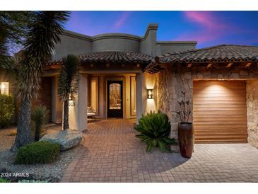 Luxury home with a courtyard entry and three-car garage at 25313 N 114Th St, Scottsdale, AZ 85255