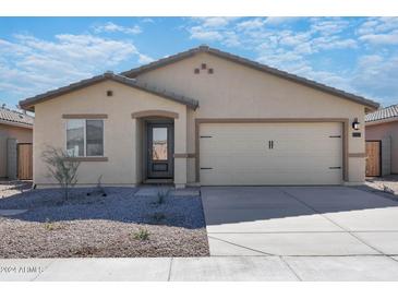 New single-story home with two-car garage and desert landscaping at 24594 W St Catherine Ave, Buckeye, AZ 85326
