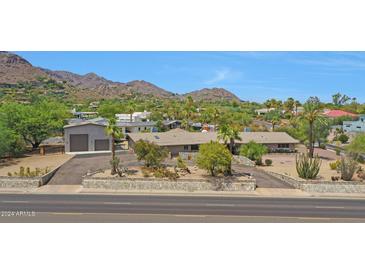 Luxury home with a large yard and mountain views at 4452 E Lincoln Dr, Paradise Valley, AZ 85253