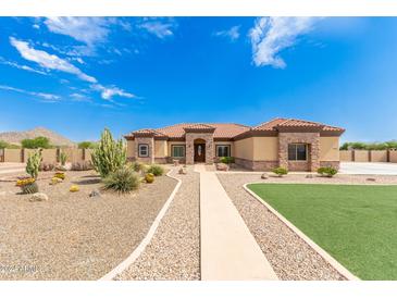 Single story home with desert landscaping and walkway at 6786 W Gelding Ln, Coolidge, AZ 85128