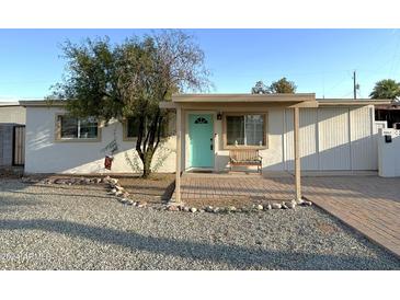Charming single story home with a covered porch at 2057 E Howe Ave, Tempe, AZ 85281
