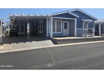 Nice curb appeal, covered parking, and welcoming front porch at 650 N Hawes Rd # 3404, Mesa, AZ 85207
