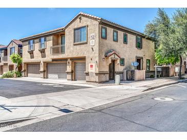 Two story townhome with attached garage and front yard at 8110 W Groom Creek Rd # 12, Phoenix, AZ 85043