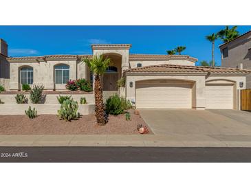 Two-story house with desert landscaping and two-car garage at 15210 S 20Th St, Phoenix, AZ 85048