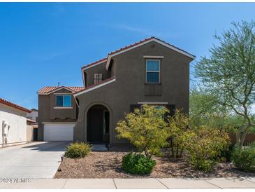 Two-story house with a gray facade and arched entryway at 7351 W Palo Brea Ln, Peoria, AZ 85383