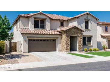 Two-story home with stone accents and attached garage at 2848 E Presidio St, Mesa, AZ 85213