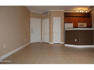 Living Room, Kitchen, and entryway with tile flooring at 1701 E Colter St # 291, Phoenix, AZ 85016