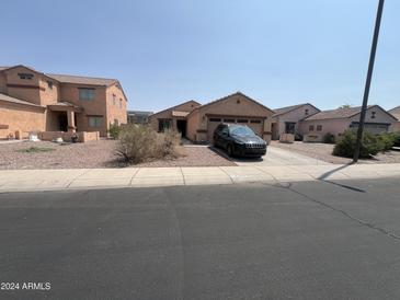 House exterior view from the street at 22005 W Cocopah St, Buckeye, AZ 85326