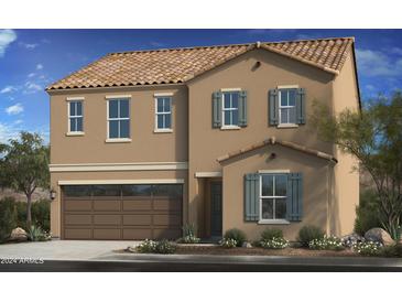 Tan two-story house with brown garage door and gray shutters at 1720 W Coolidge Way, Coolidge, AZ 85128