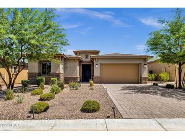 Beautiful curb appeal with landscaping and a two-car garage at 32269 N 133Rd Dr, Peoria, AZ 85383