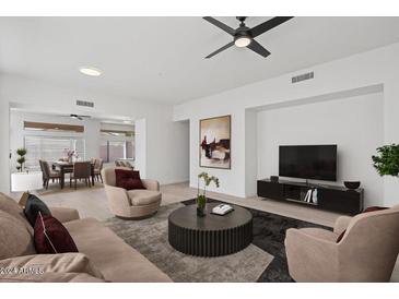 Bright and airy living room with light hardwood floors and modern furniture at 8875 E Conquistadores Dr, Scottsdale, AZ 85255