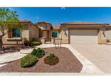 Single-story home with a two-car garage and desert landscaping at 26496 W Lone Cactus Dr, Buckeye, AZ 85396