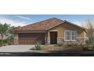 One-story home with brown garage door and stone accents at 17607 W Oberlin Way, Surprise, AZ 85387