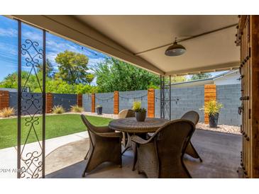 Covered patio with seating area, perfect for outdoor dining and entertaining at 2520 E Flower St, Phoenix, AZ 85016