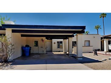 Front view of the property, showing carport and entrance at 3013 W Hearn Rd, Phoenix, AZ 85053