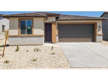 Charming single-story home with a two-car garage at 22322 W Burnett Rd, Surprise, AZ 85387