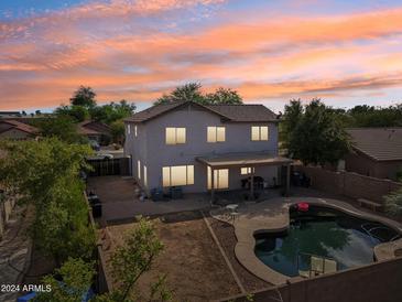 Two-story home with a pool and backyard patio at 1356 E 9Th Pl, Casa Grande, AZ 85122