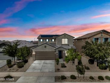 Two-story house with a gray facade and solar panels at 17946 W Via Del Sol --, Surprise, AZ 85387