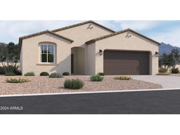 Single-story home with a two-car garage and desert landscaping at 24224 W Bowker St, Buckeye, AZ 85326