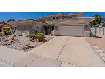 Front view of two story house with stone accents at 3806 E Taurus Pl, Chandler, AZ 85249