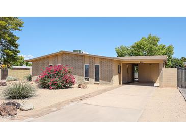 Charming single story home with a well-maintained front yard at 2316 E Betty Elyse Ln, Phoenix, AZ 85022