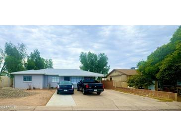 Single story home with a well-maintained front yard at 5919 W Marlette Ave, Glendale, AZ 85301