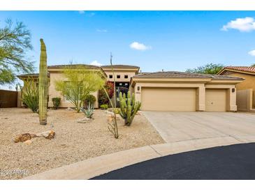 Two-story home with desert landscaping and two-car garage at 8856 E Via De Luna Dr, Scottsdale, AZ 85255