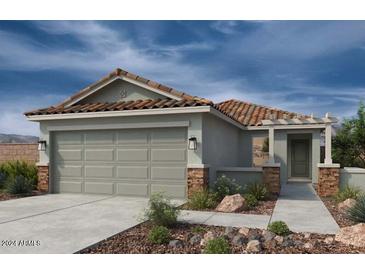One-story home with a two-car garage and Spanish-style tile roof at 18485 N Tanners Way, Maricopa, AZ 85138