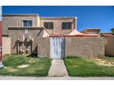 Exterior view of a two story townhome at 6842 W Devonshire Ave, Phoenix, AZ 85033