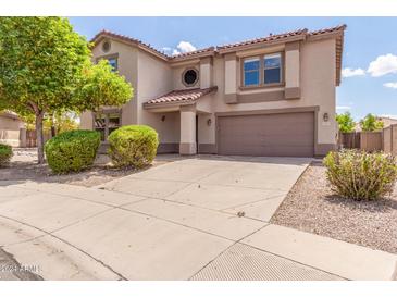 Two-story home with attached garage and landscaping at 11543 E Quade Ave, Mesa, AZ 85212