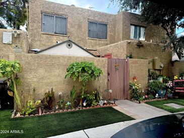 Charming home with a well-maintained front yard at 4255 N 67Th Ln, Phoenix, AZ 85033