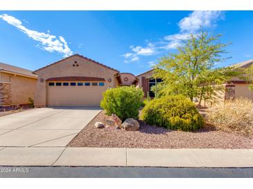 Tan two-story house with attached garage at 9985 E Legend Ct, Gold Canyon, AZ 85118